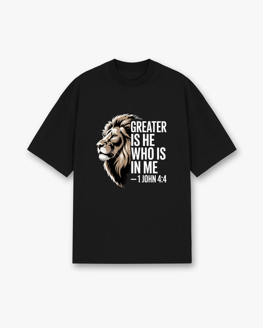 Greater Is He 1 John 4:4 Christian T-Shirt - Black Christian t-shirt featuring lion of Judah illustration, bold white typography - Faith-based apparel for believers
